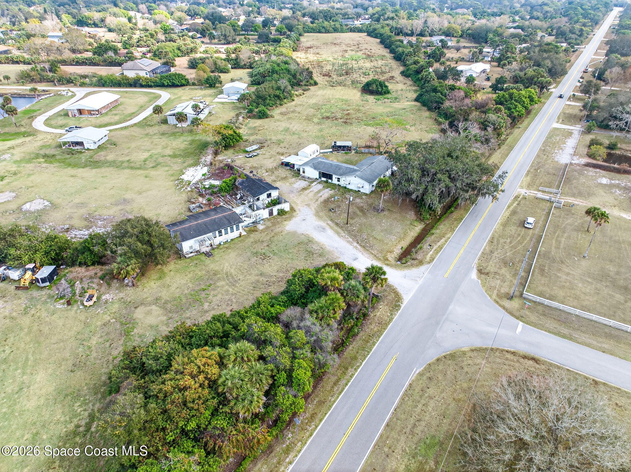 3825 Turtle Mound Road Melbourne, FL 32934 - Photo 12 of 19 an aerial view of residential houses with outdoor space