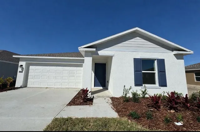 a front view of house with yard