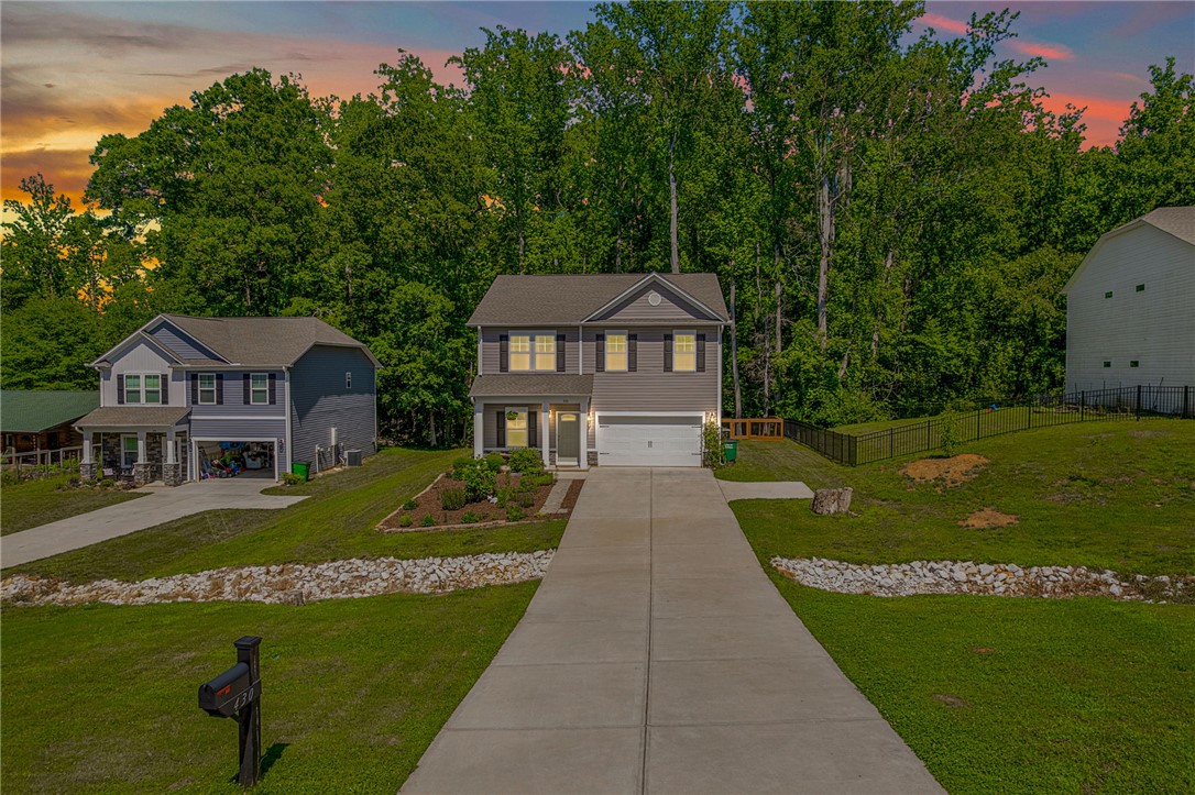 430 Johnson Road Central, SC 29630 - Photo 31 of 36 Two-story home with a pristine driveway leads to a welcoming front entrance.