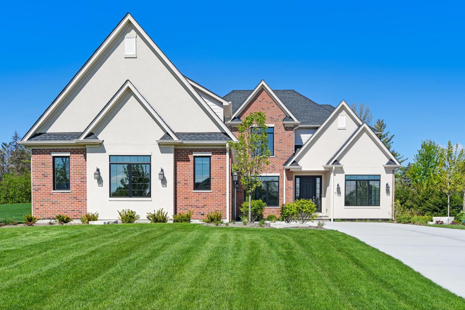 8310 Waterview Drive Burr Ridge, IL 60527 - Photo 1 of 35 a front view of a house with a yard
