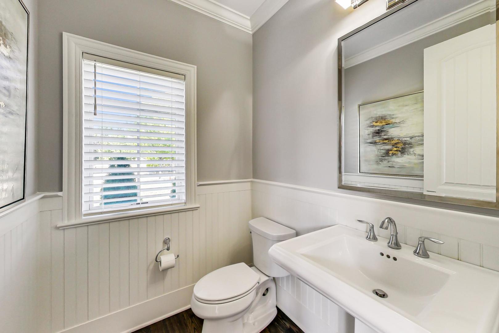 8310 Waterview Drive Burr Ridge, IL 60527 - Photo 11 of 35 a bathroom with a toilet a sink and a mirror