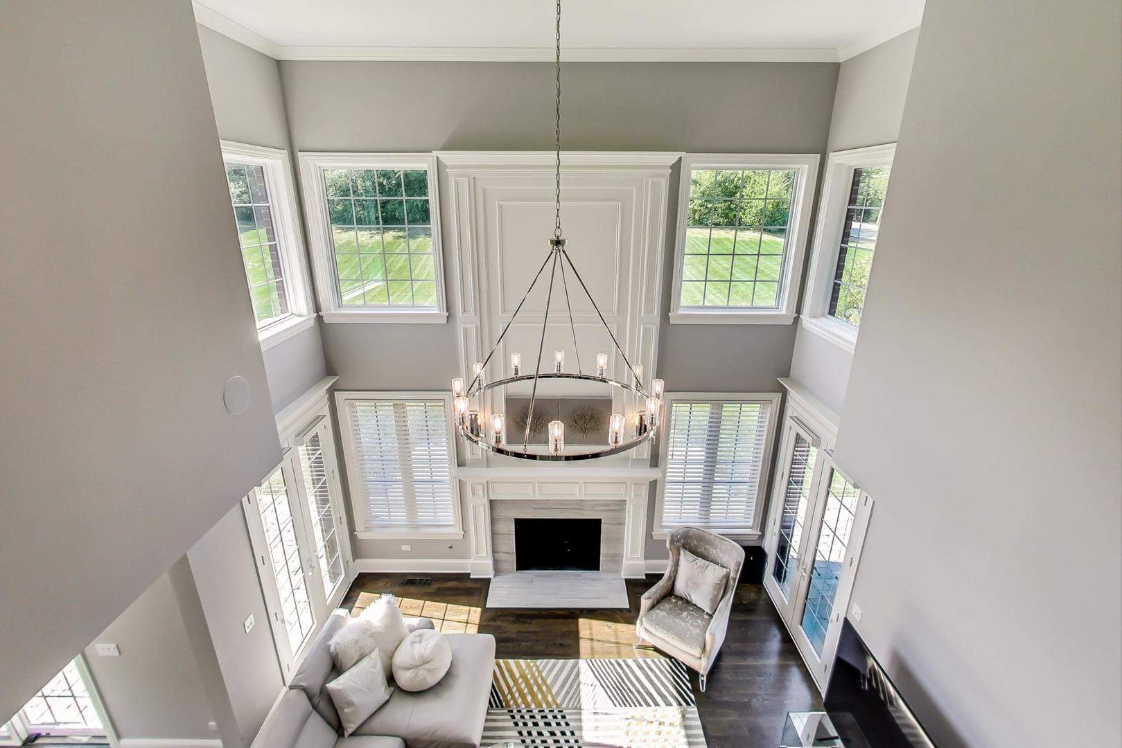 8310 Waterview Drive Burr Ridge, IL 60527 - Photo 13 of 35 a living room with furniture and a fireplace