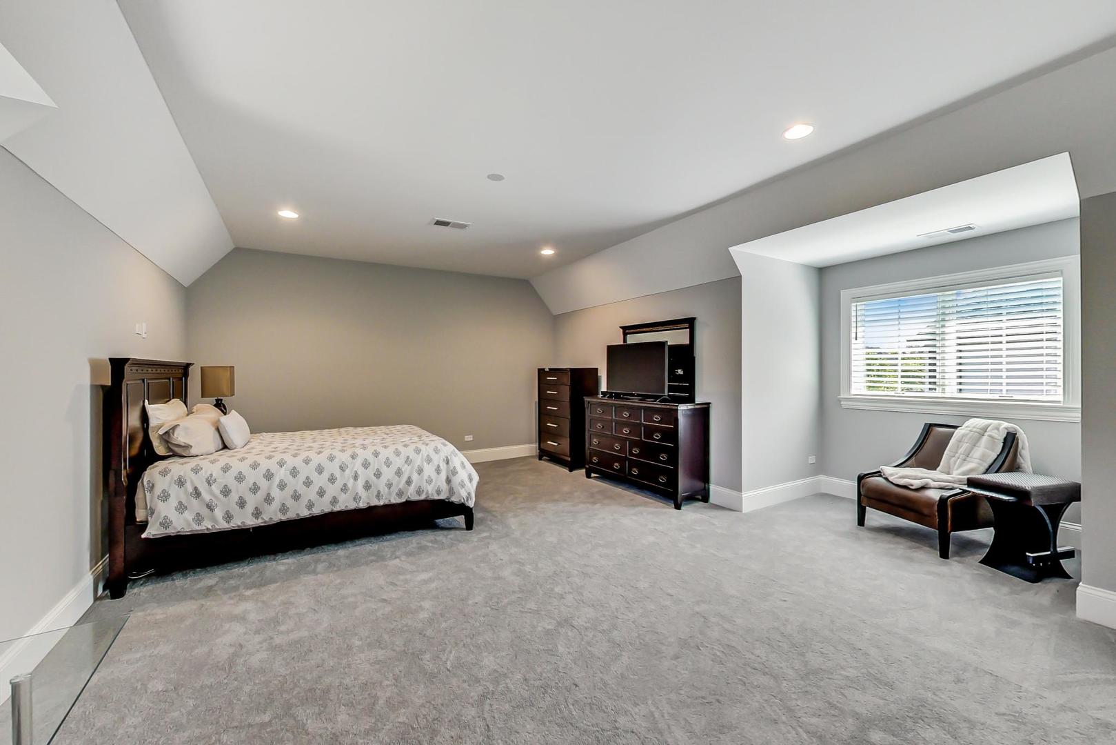 8310 Waterview Drive Burr Ridge, IL 60527 - Photo 17 of 35 a living room with furniture and a flat screen tv