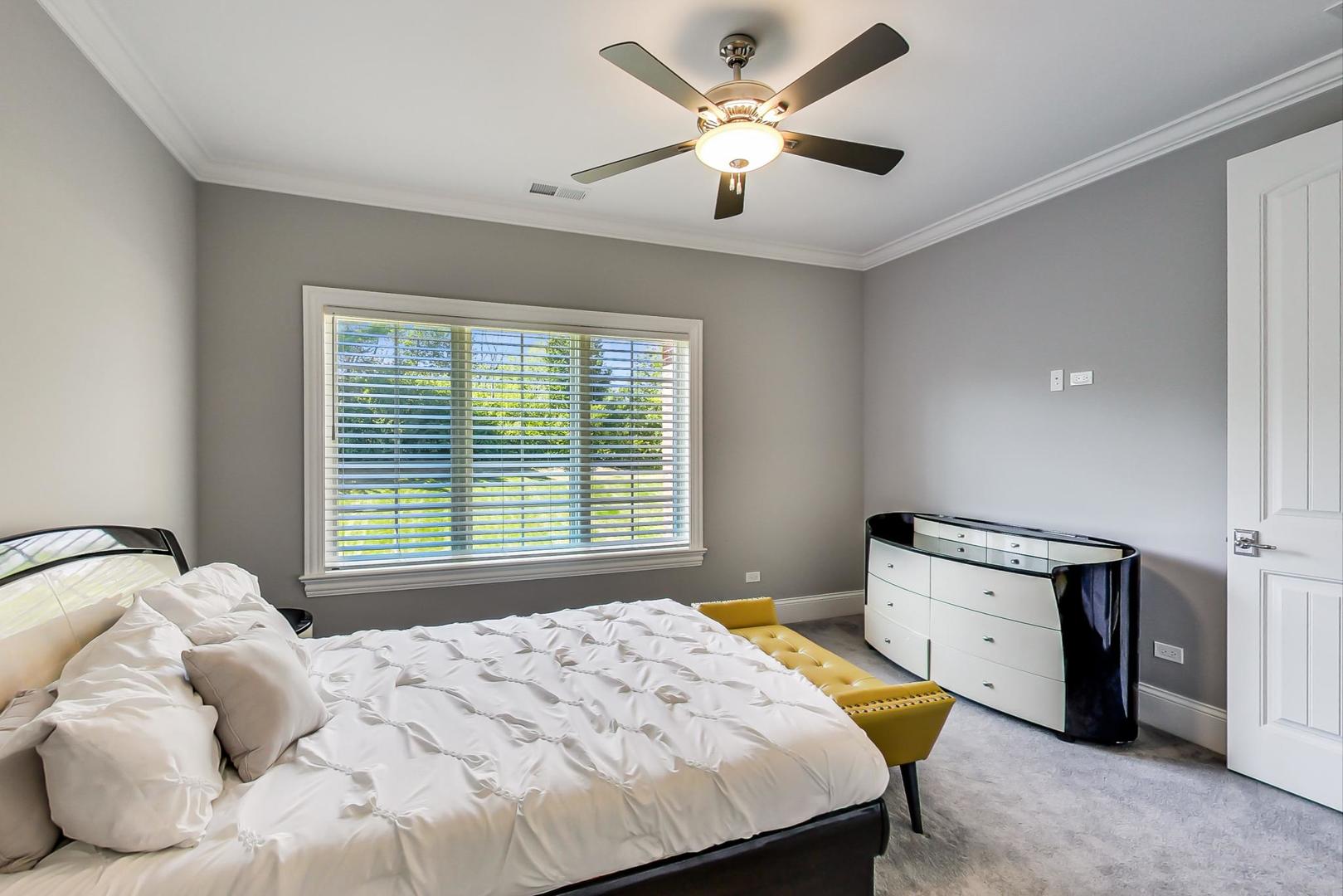 8310 Waterview Drive Burr Ridge, IL 60527 - Photo 21 of 35 a bedroom with a bed and a window