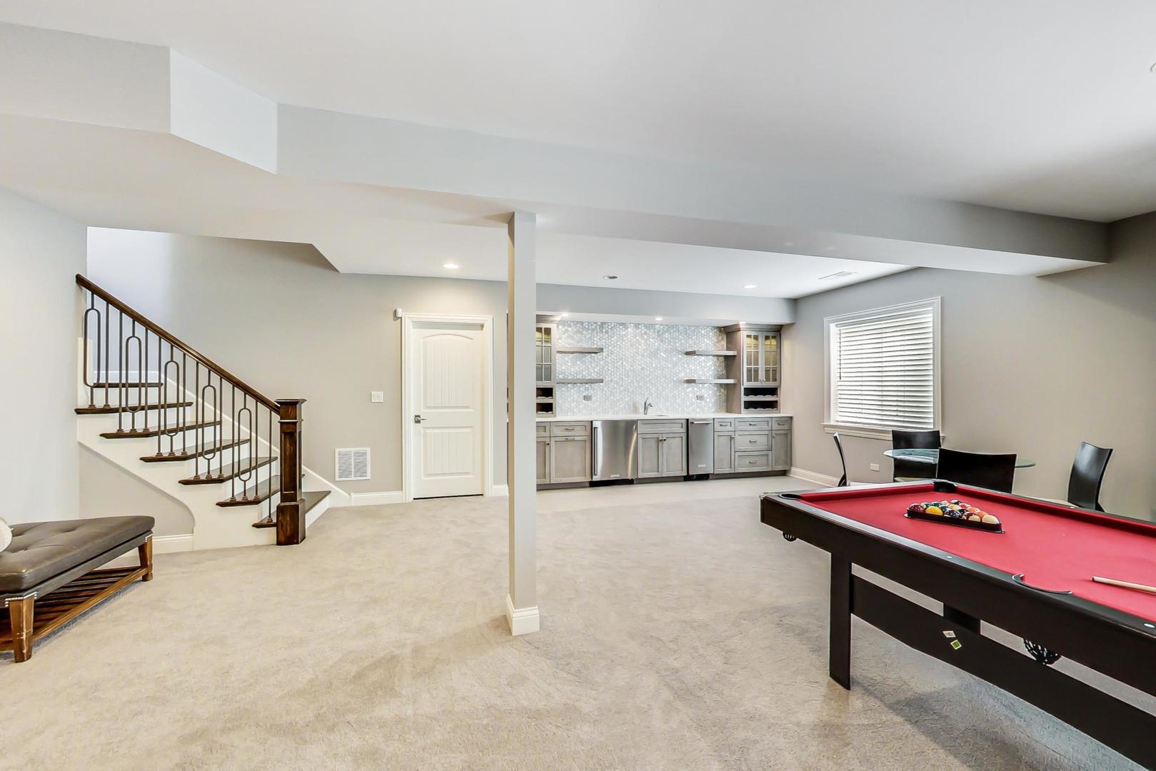 8310 Waterview Drive Burr Ridge, IL 60527 - Photo 22 of 35 a room with gym equipment and wooden floor