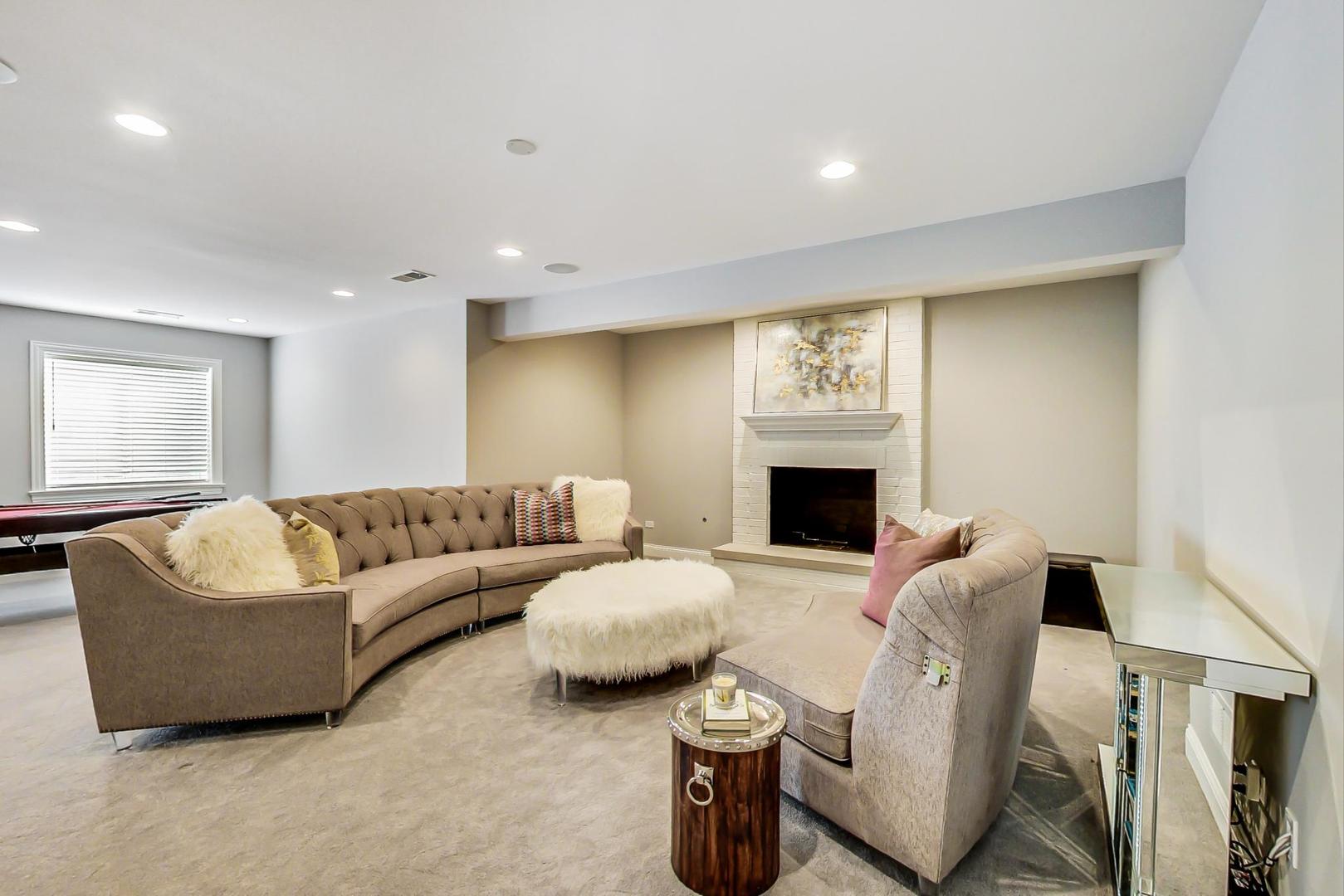 8310 Waterview Drive Burr Ridge, IL 60527 - Photo 25 of 35 a living room with furniture fireplace and window