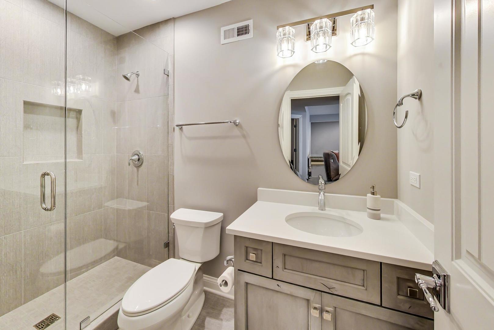 8310 Waterview Drive Burr Ridge, IL 60527 - Photo 27 of 35 a bathroom with a toilet sink shower and mirror