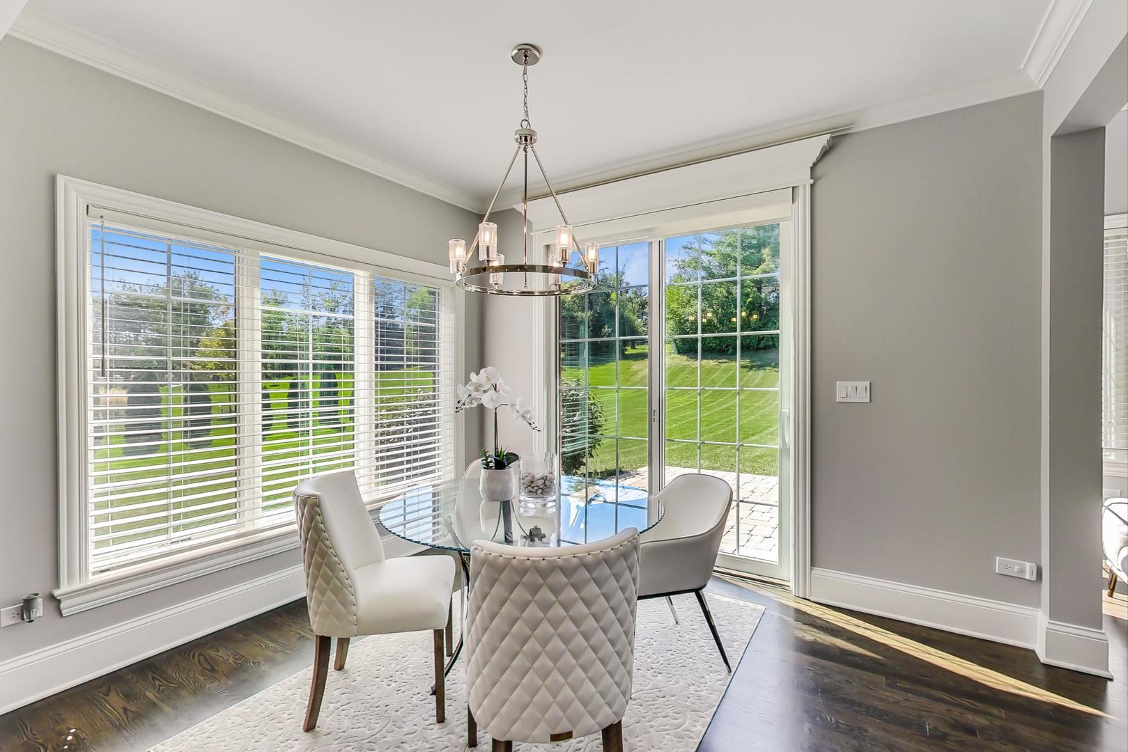 8310 Waterview Drive Burr Ridge, IL 60527 - Photo 8 of 35 a dining room with furniture window wooden floor