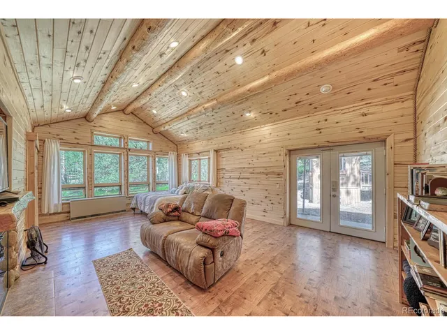 a kitchen with refrigerator and cabinets