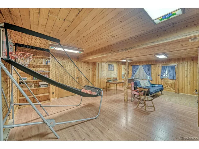 a open kitchen with sink and dishwasher with wooden floor
