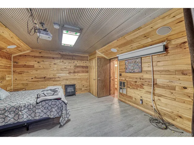 a black and white house with a yard