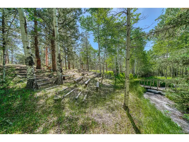 a view of a wooden deck with a bench