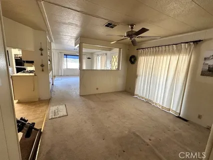 a kitchen with stainless steel appliances a refrigerator sink and microwave
