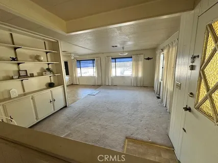 a view of livingroom with furniture and windows