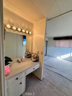 en empty room with windows and ceiling fan