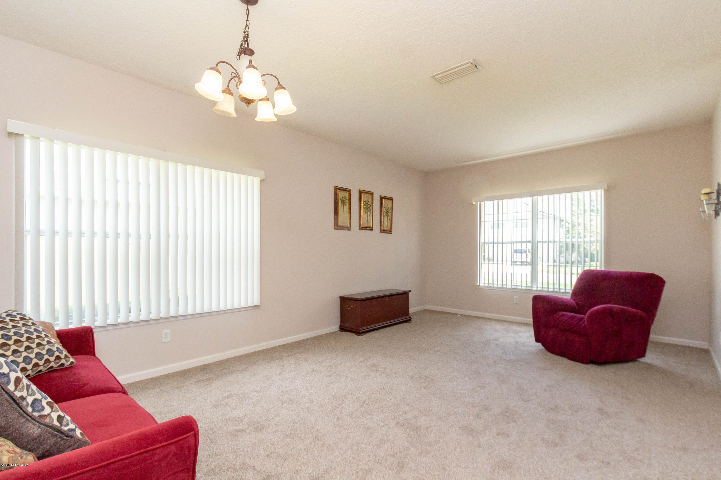 321 Stonehurst Parkway St. Augustine, FL 32092 - Photo 14 of 60 a living room with furniture and a large window
