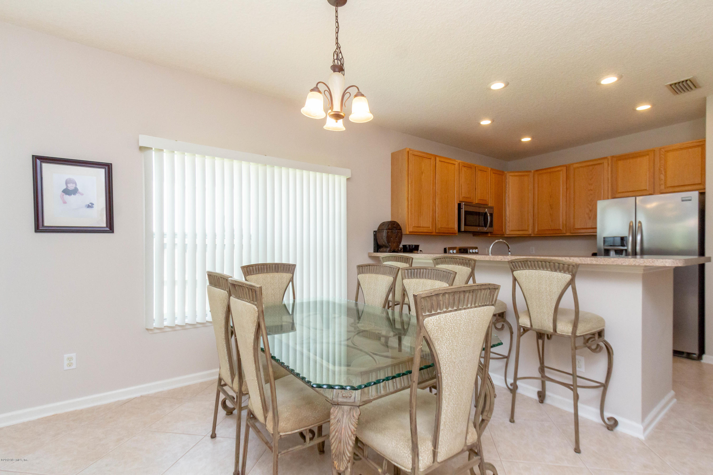 321 Stonehurst Parkway St. Augustine, FL 32092 - Photo 20 of 60 a view of a dining room with furniture window and outside view