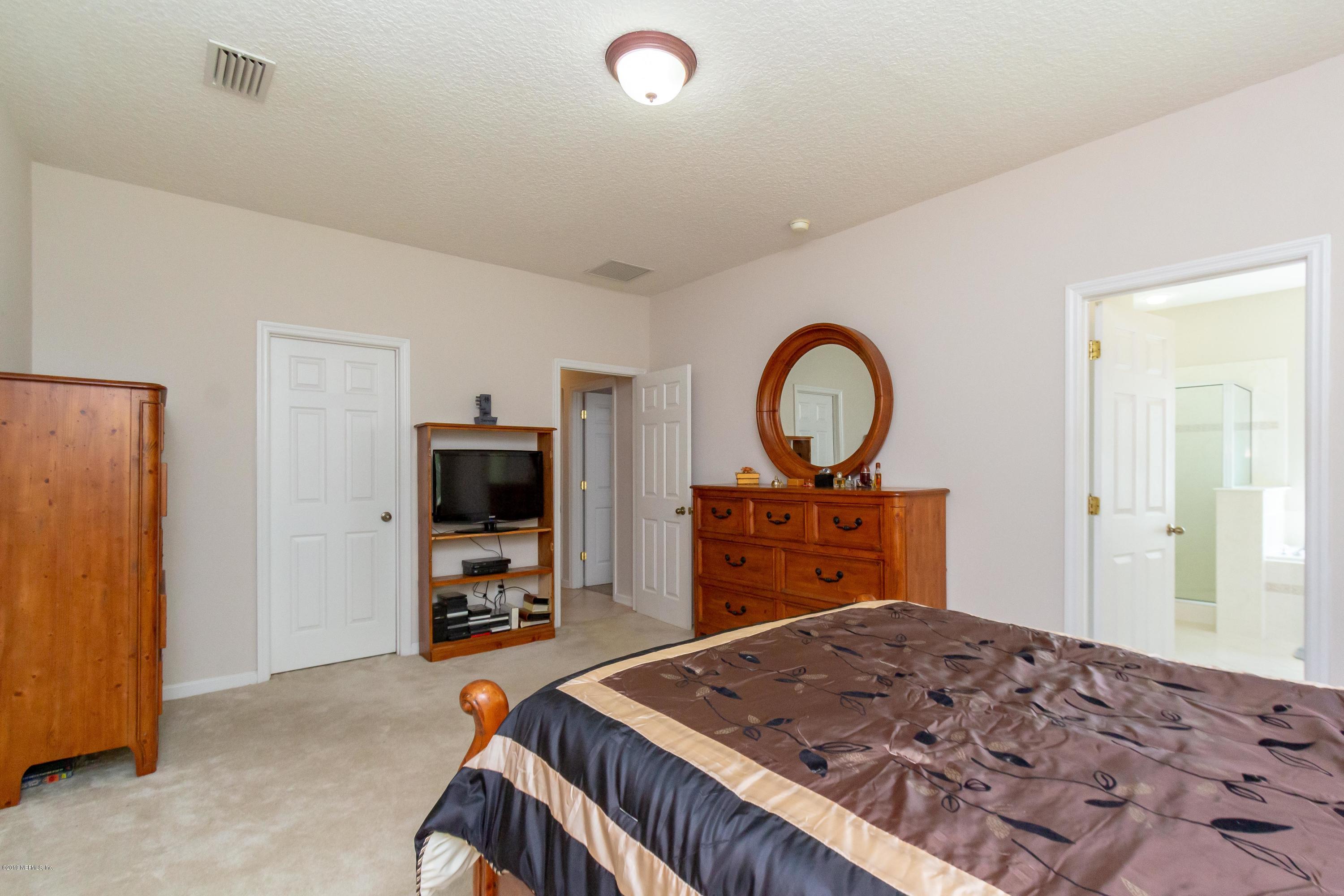 321 Stonehurst Parkway St. Augustine, FL 32092 - Photo 27 of 60 a bed room with a bed and a television