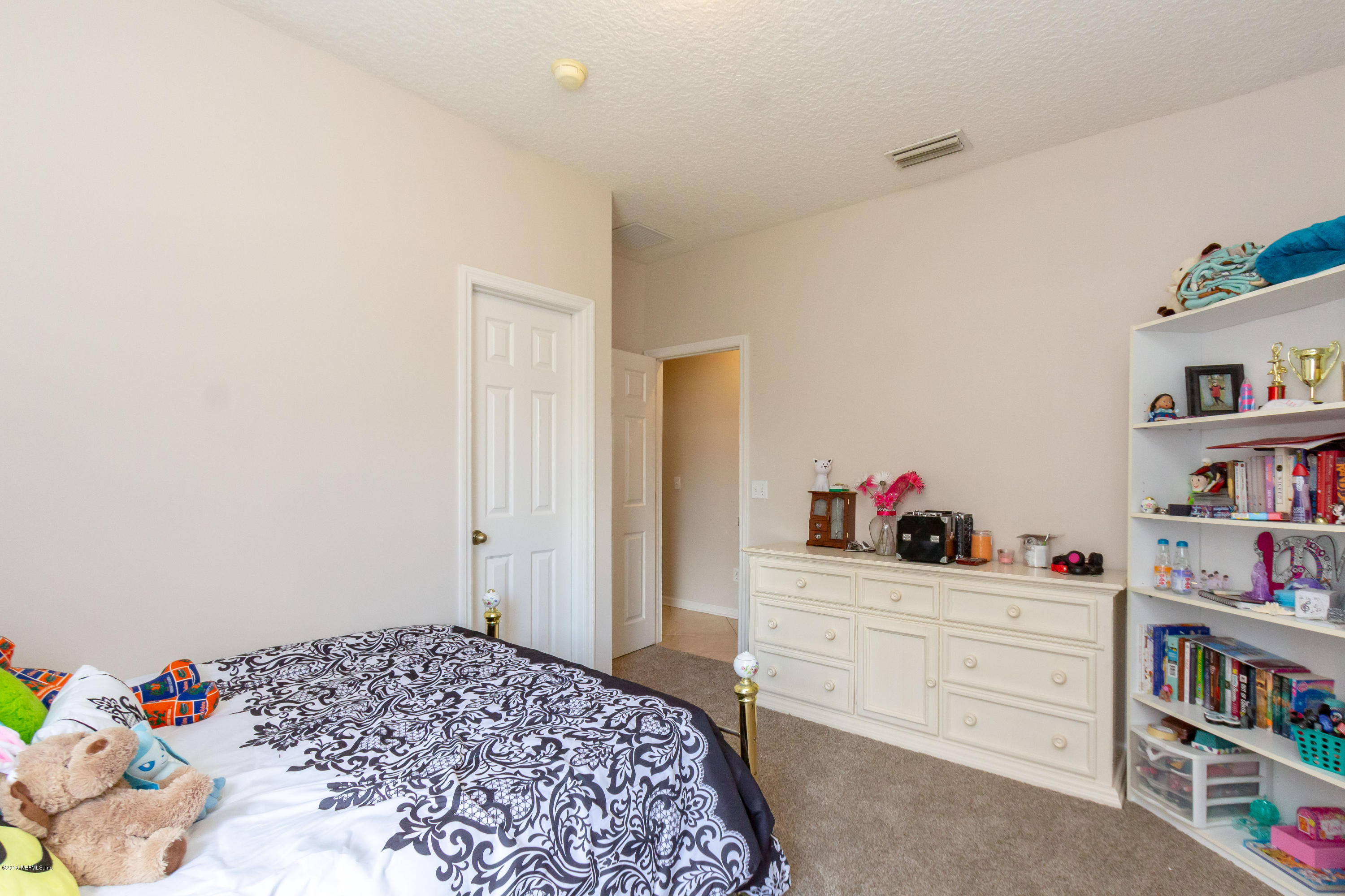 321 Stonehurst Parkway St. Augustine, FL 32092 - Photo 34 of 60 a bedroom with a bed and closet