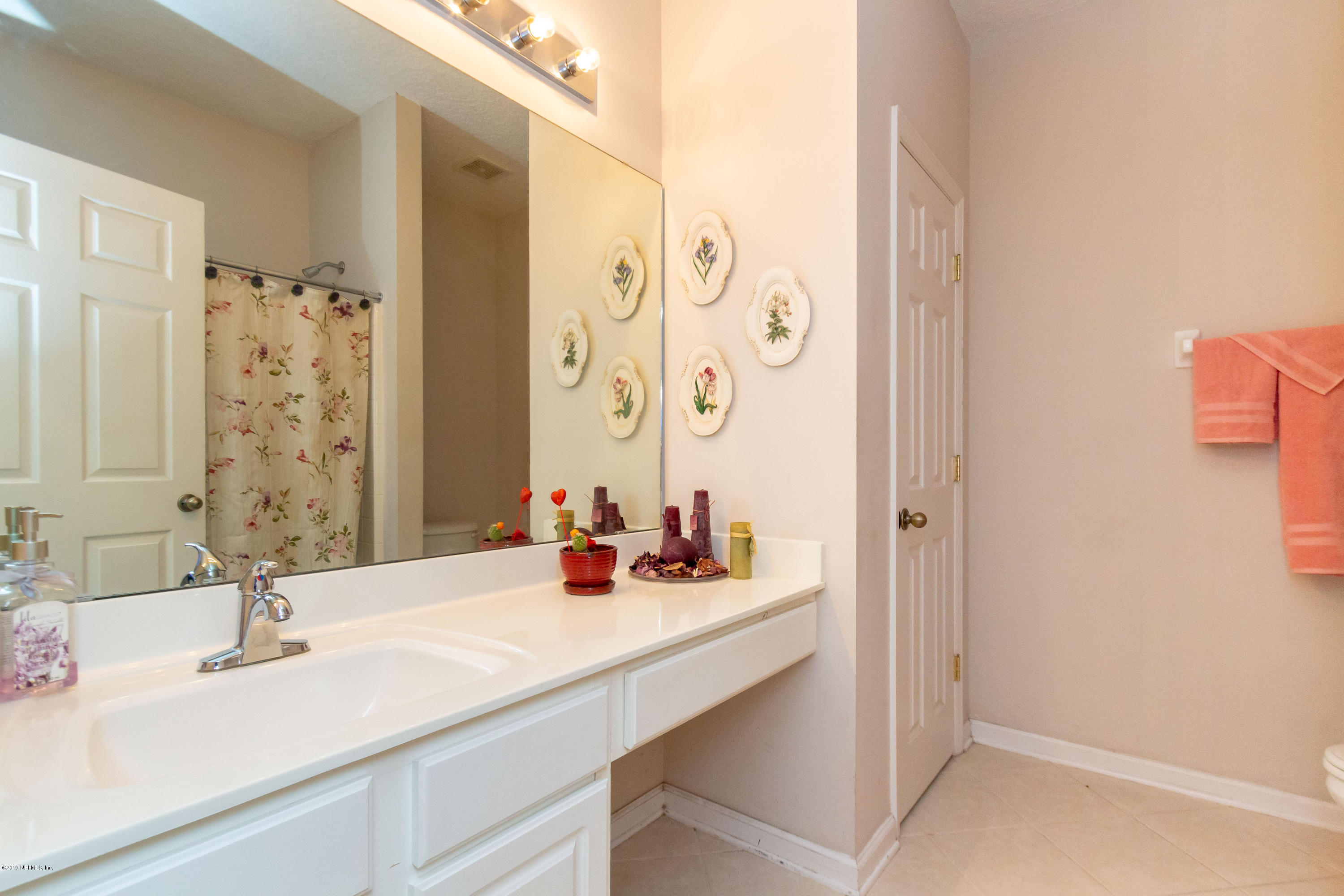 321 Stonehurst Parkway St. Augustine, FL 32092 - Photo 36 of 60 a bathroom with a sink and a mirror