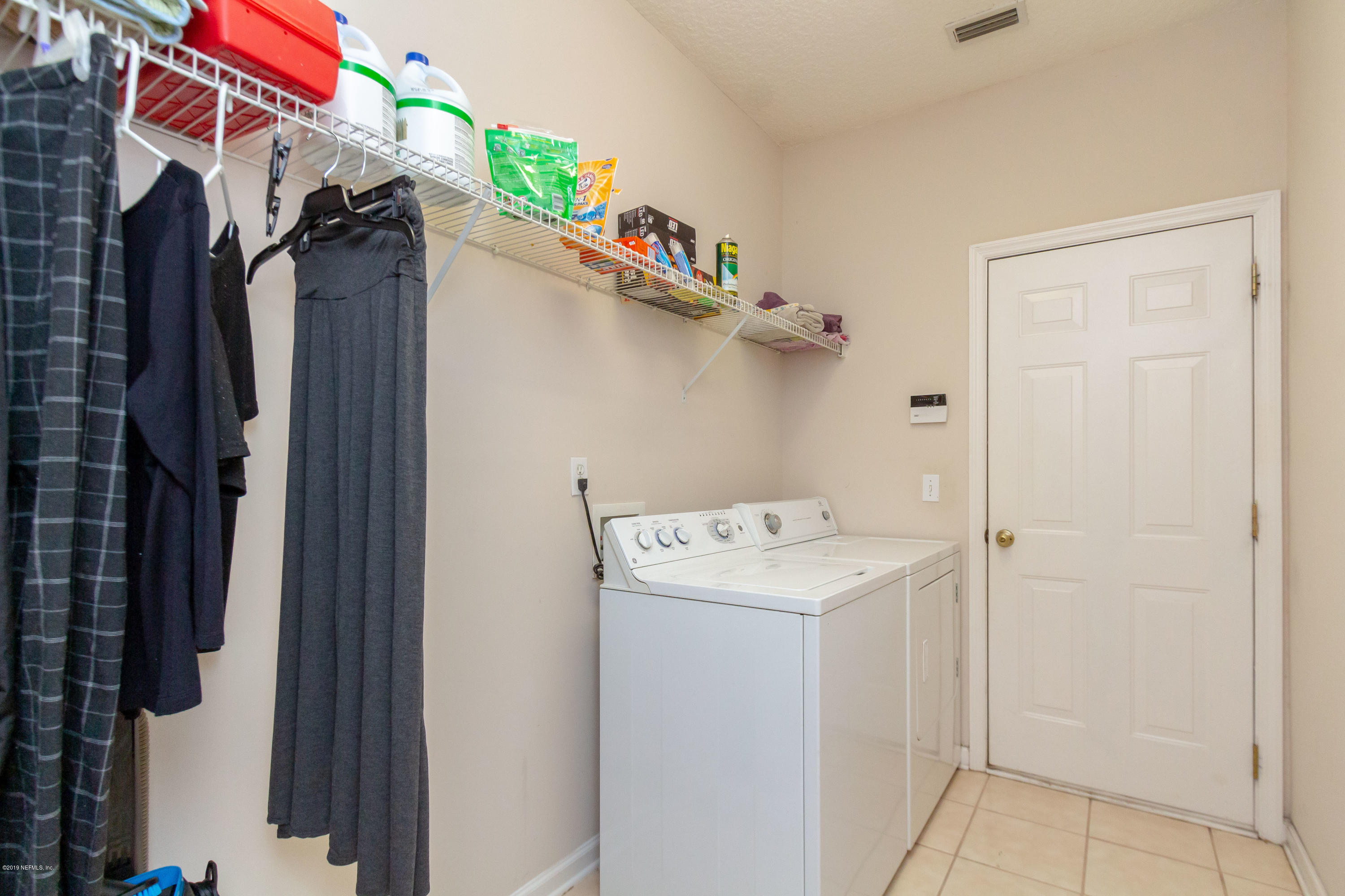 321 Stonehurst Parkway St. Augustine, FL 32092 - Photo 37 of 60 a utility room with dryer and washer