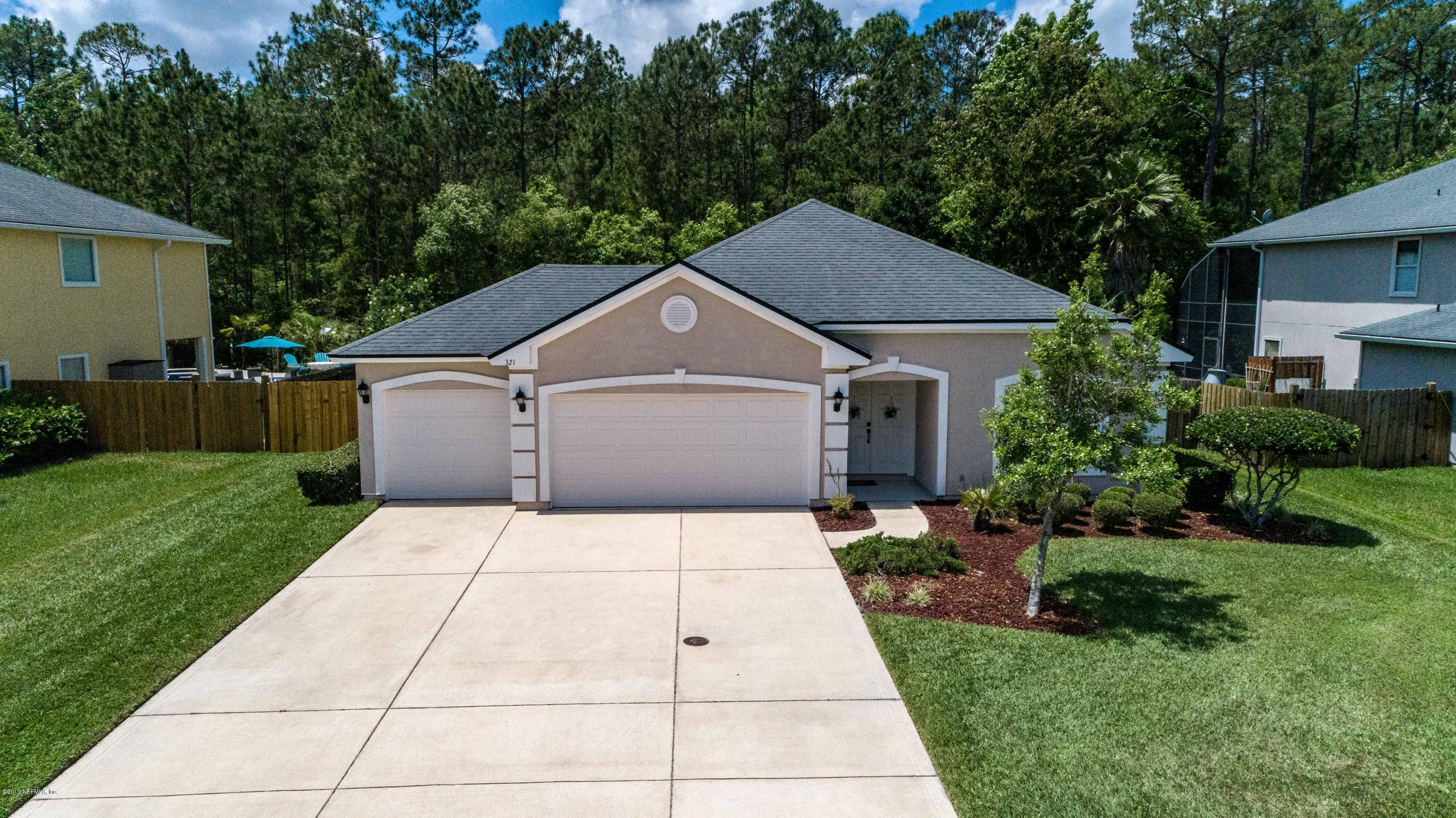 321 Stonehurst Parkway St. Augustine, FL 32092 - Photo 5 of 60 a backyard of a house with lots of green space