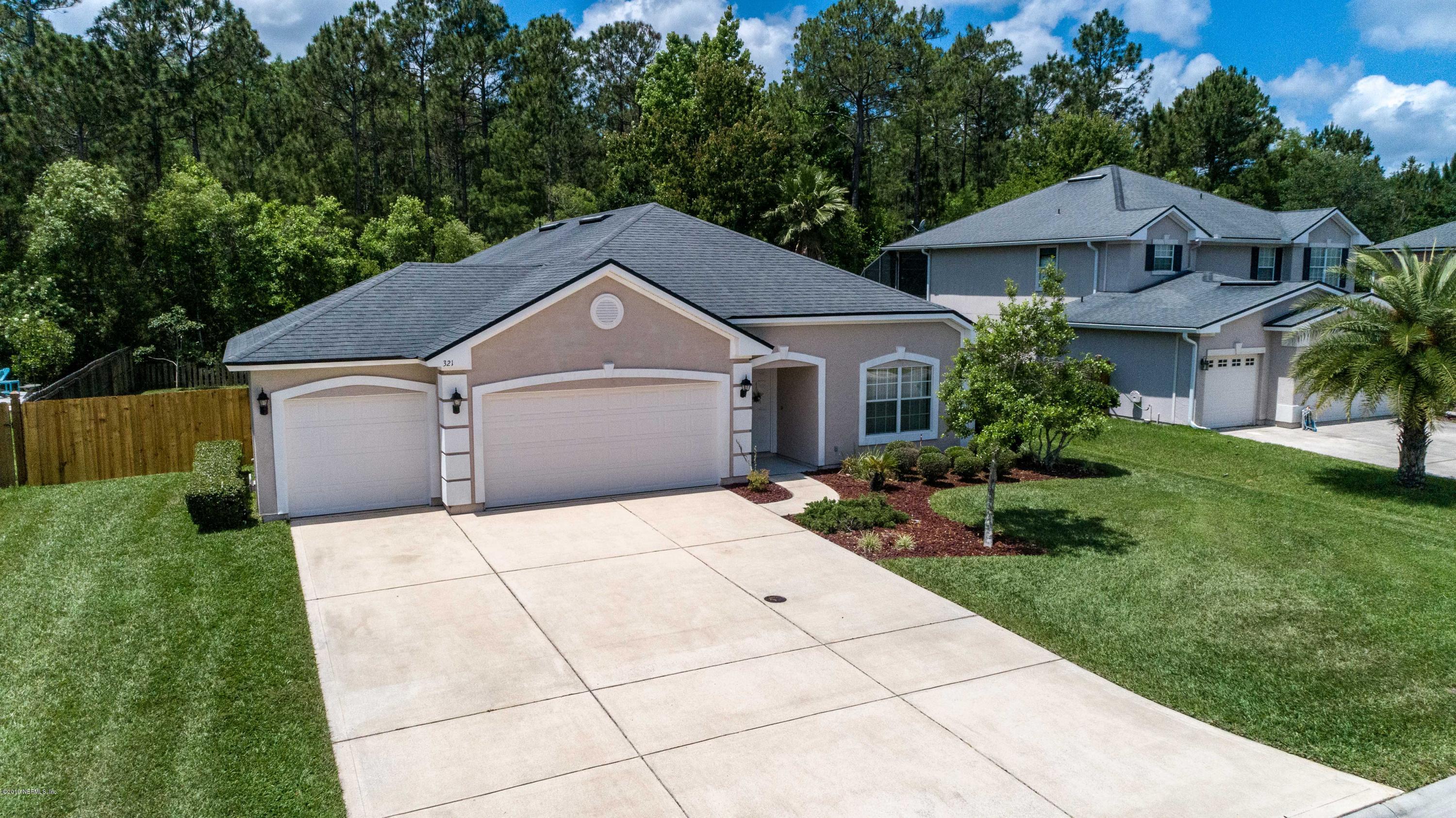 321 Stonehurst Parkway St. Augustine, FL 32092 - Photo 55 of 60 a front view of a house with a yard