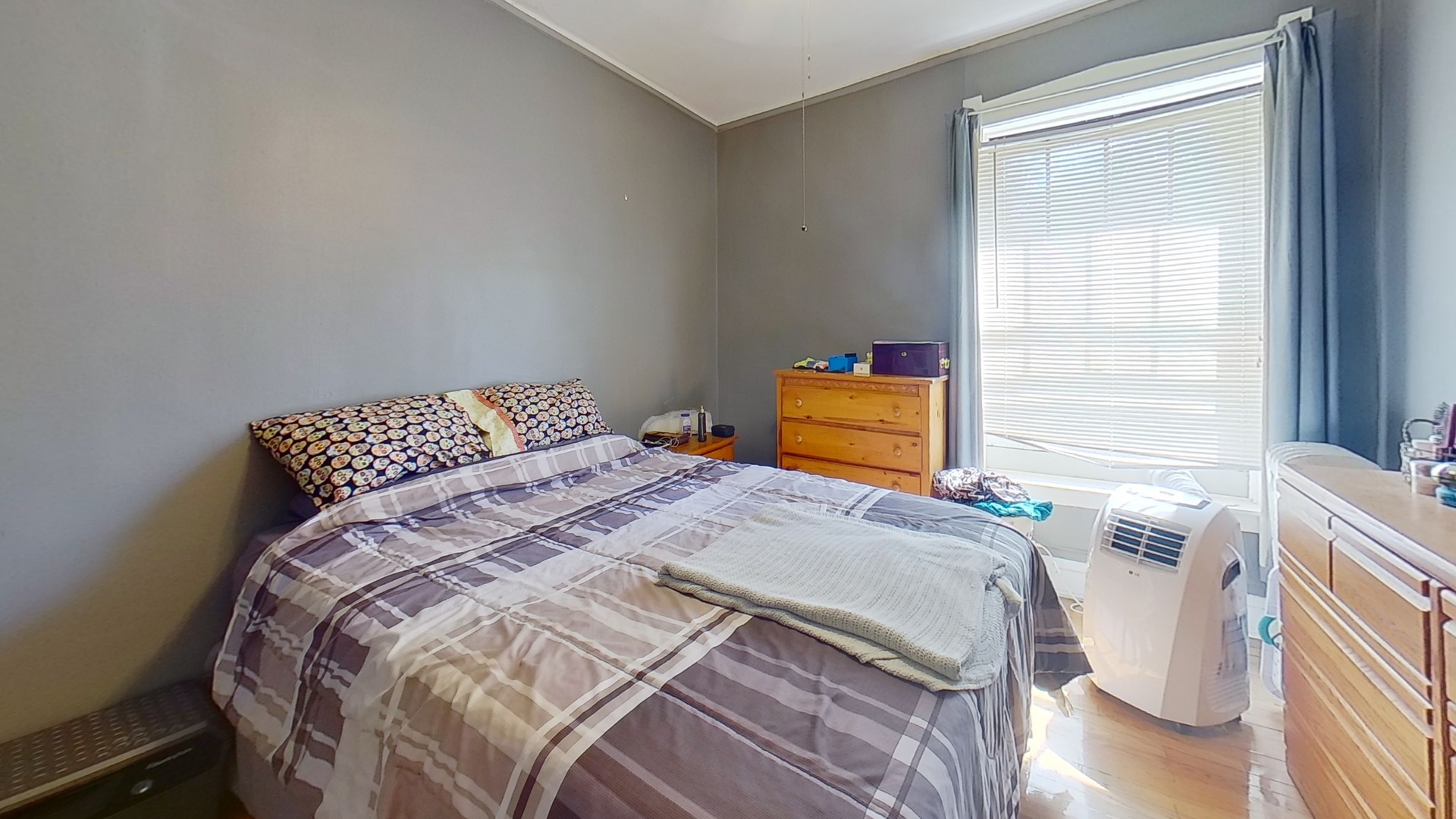 801 Monroe Street, Unit 1 Evanston, IL 60202 - Photo 17 of 24 a bedroom with a bed and a window