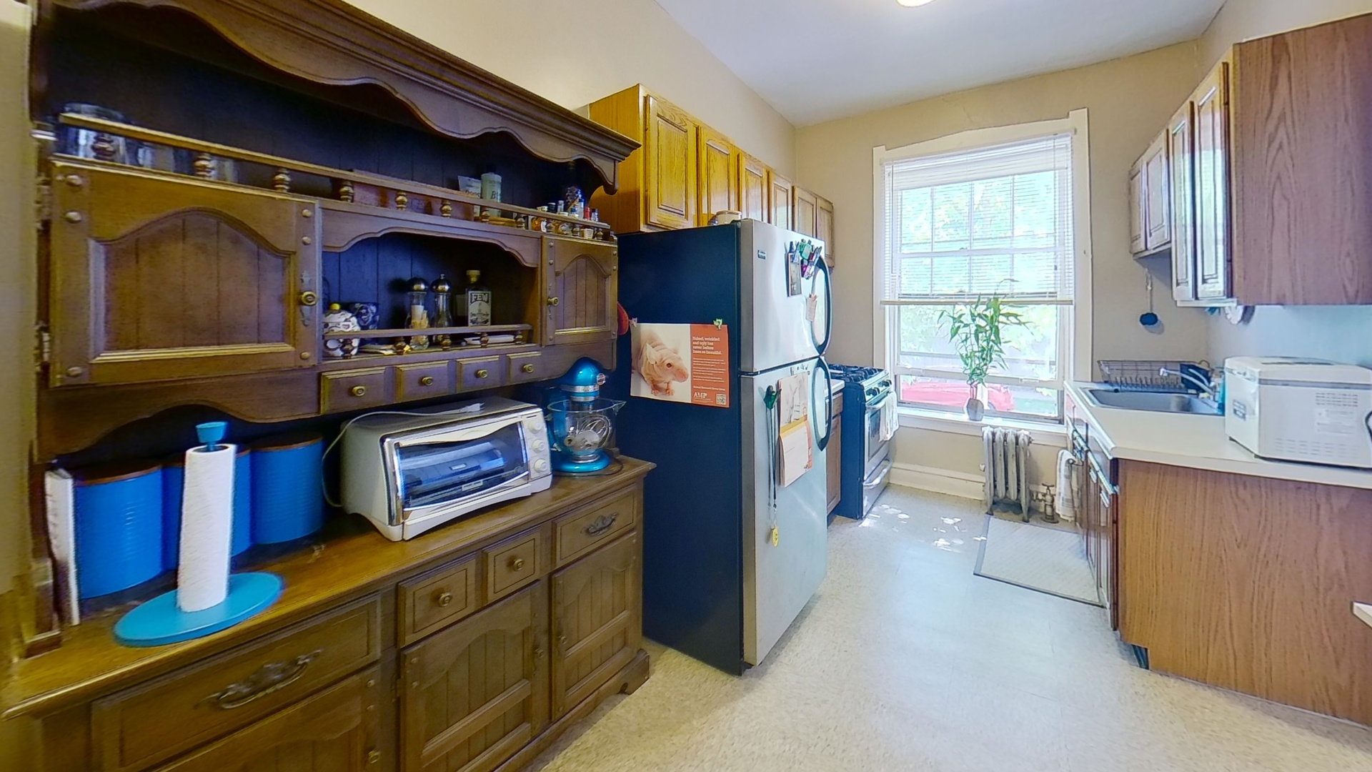 801 Monroe Street, Unit 1 Evanston, IL 60202 - Photo 19 of 24 a kitchen with cabinets and window
