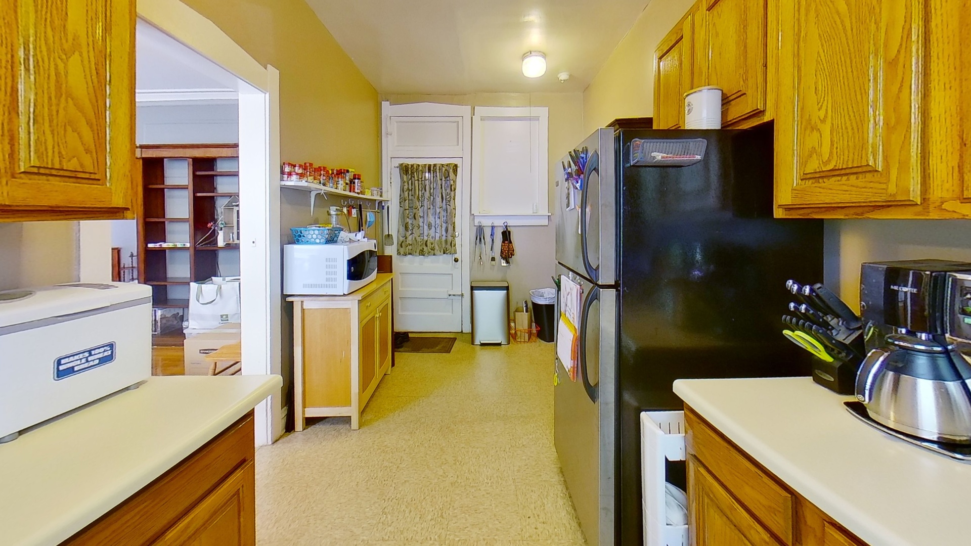 801 Monroe Street, Unit 1 Evanston, IL 60202 - Photo 20 of 24 a kitchen with stainless steel appliances granite countertop a refrigerator and a sink