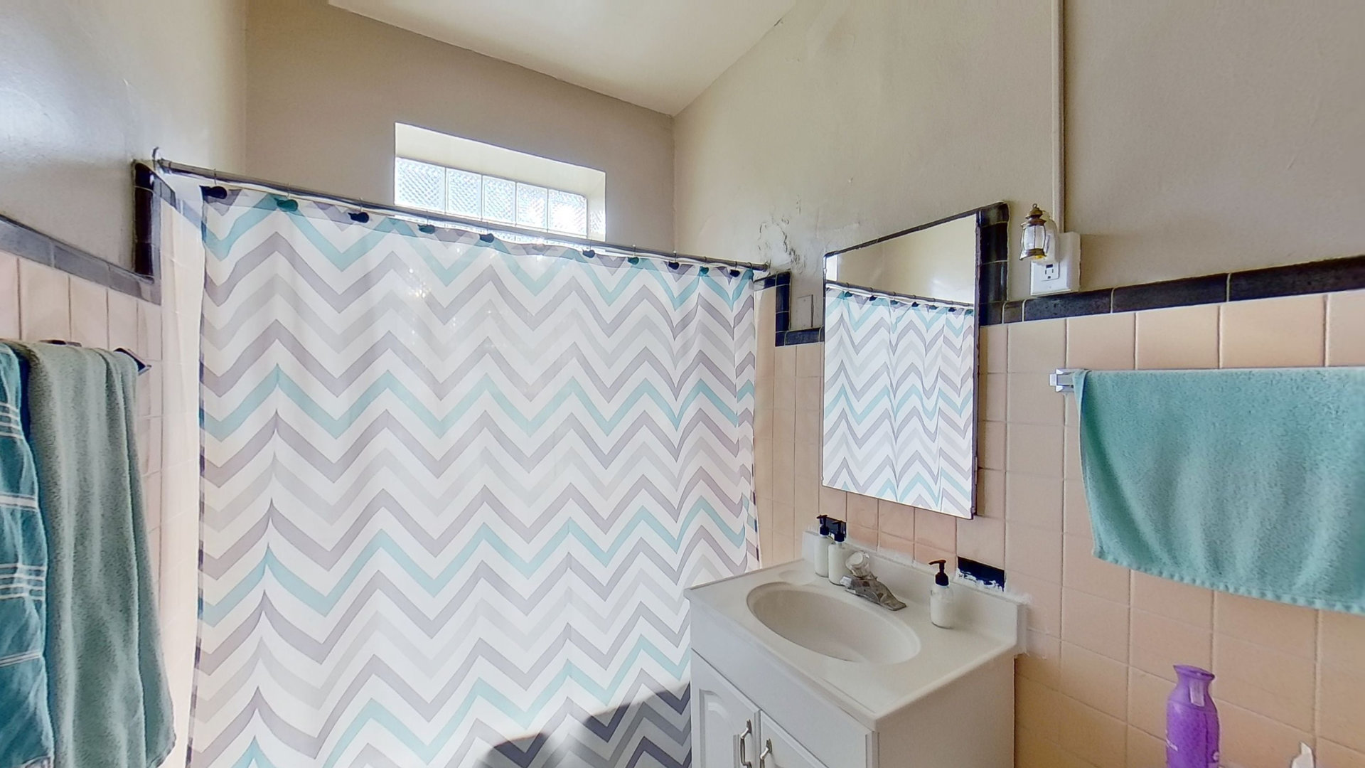 801 Monroe Street, Unit 1 Evanston, IL 60202 - Photo 6 of 24 a bathroom with a sink and a mirror