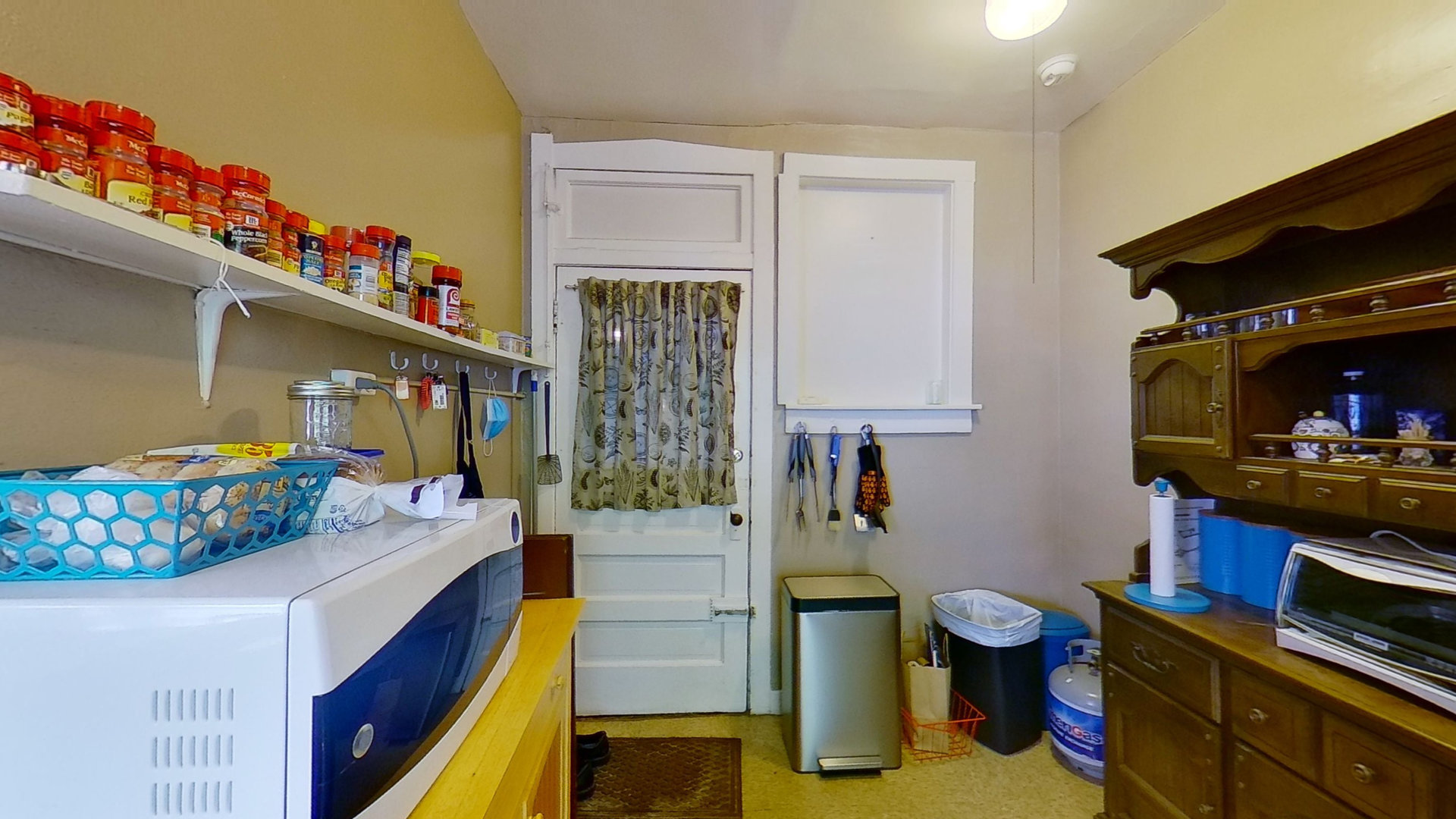 801 Monroe Street, Unit 1 Evanston, IL 60202 - Photo 9 of 24 a kitchen that has a lot of fruit on it and cabinets