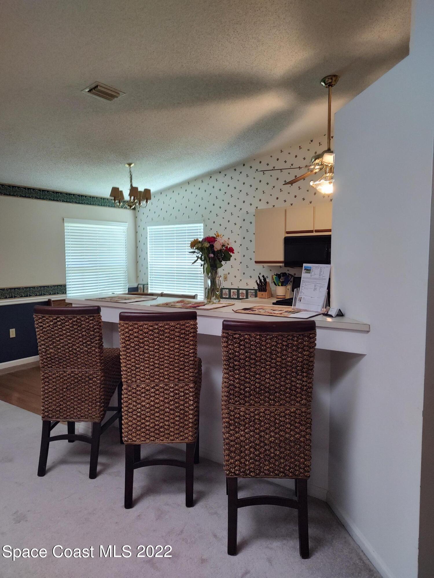 1233 Walnut Grove Way Rockledge, FL 32955 - Photo 18 of 19 a dining room with furniture and window