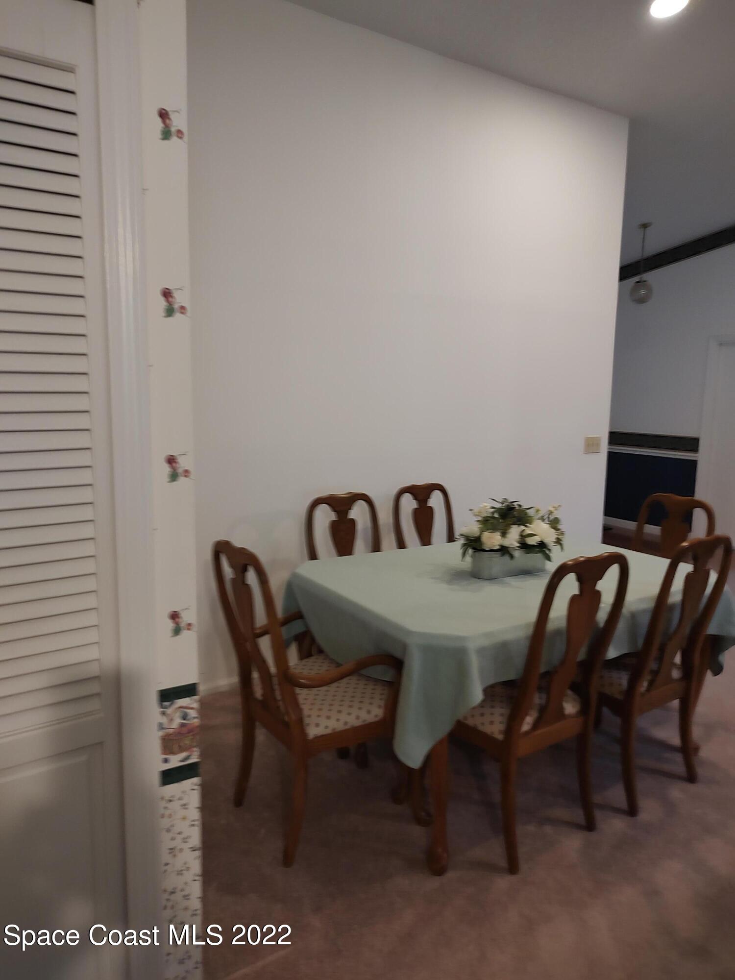 1233 Walnut Grove Way Rockledge, FL 32955 - Photo 6 of 19 a view of a room with table and chair