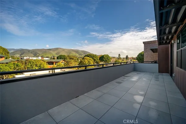 a view of a chairs and table in the patio
