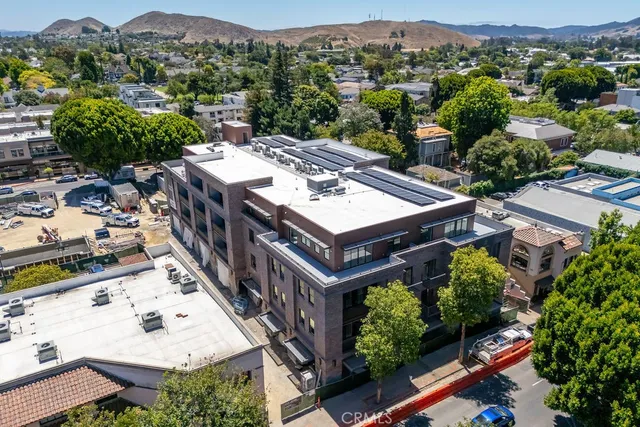 an aerial view of a house with a garden
