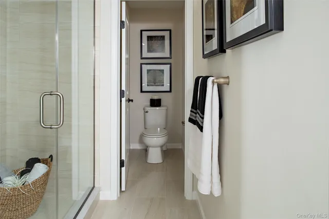 a bedroom with a bed and a television