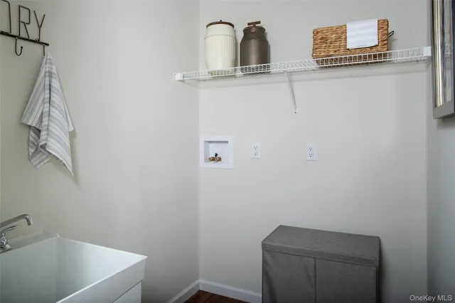 a bathroom with a granite countertop sink a toilet and shower