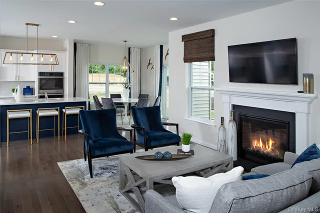 a kitchen with a sink a counter and chairs