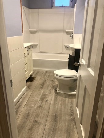 20 Bennett Street Beverly, MA 01915 - Photo 11 of 20 a bathroom with a toilet and a shower