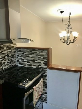 20 Bennett Street Beverly, MA 01915 - Photo 13 of 20 a kitchen with a stove and a sink