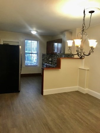 20 Bennett Street Beverly, MA 01915 - Photo 17 of 20 a view of a livingroom with furniture a fireplace and window