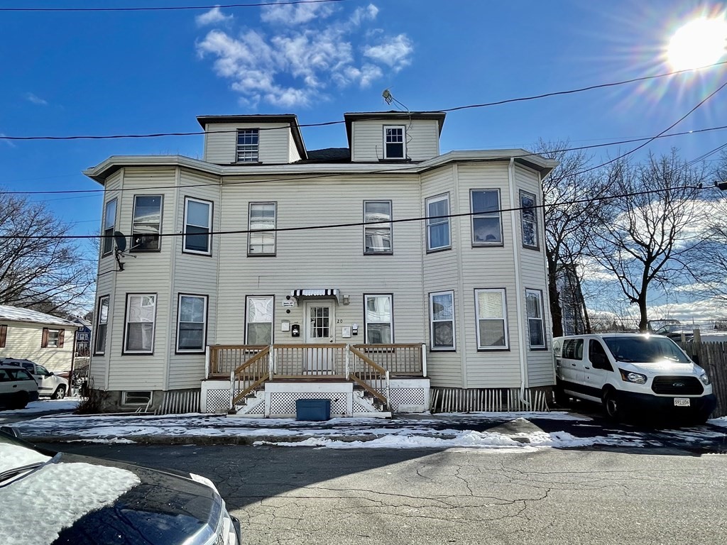 20 Bennett Street Beverly, MA 01915 - Photo 2 of 20 a front view of a building with lot of cars parked on road