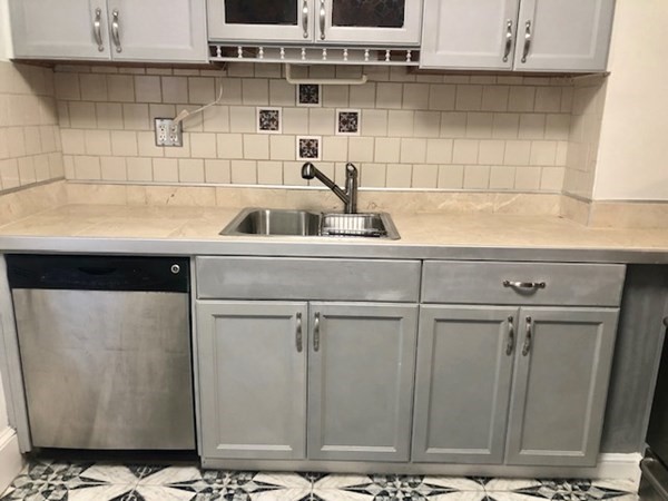 20 Bennett Street Beverly, MA 01915 - Photo 6 of 20 a kitchen with a sink and cabinets