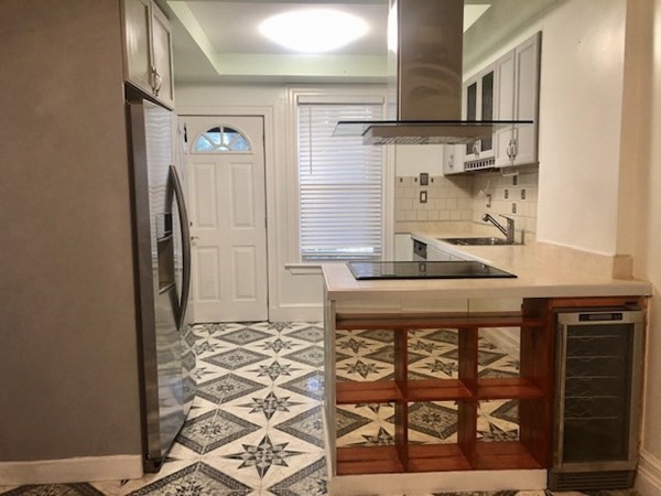 20 Bennett Street Beverly, MA 01915 - Photo 7 of 20 a kitchen with a stove and a refrigerator