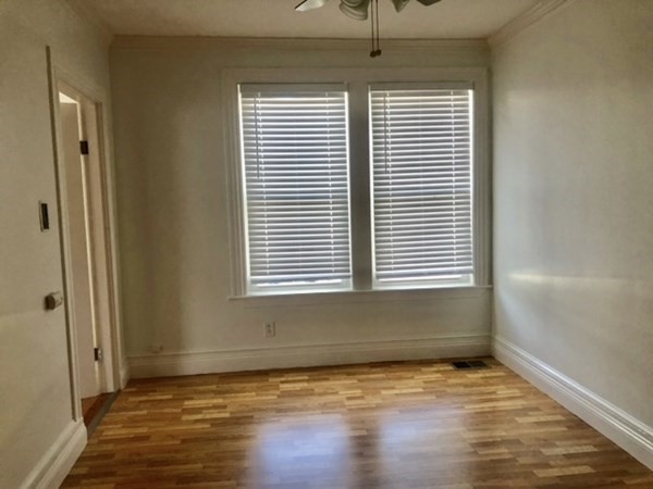 20 Bennett Street Beverly, MA 01915 - Photo 9 of 20 a view of an empty room with wooden floor and a window
