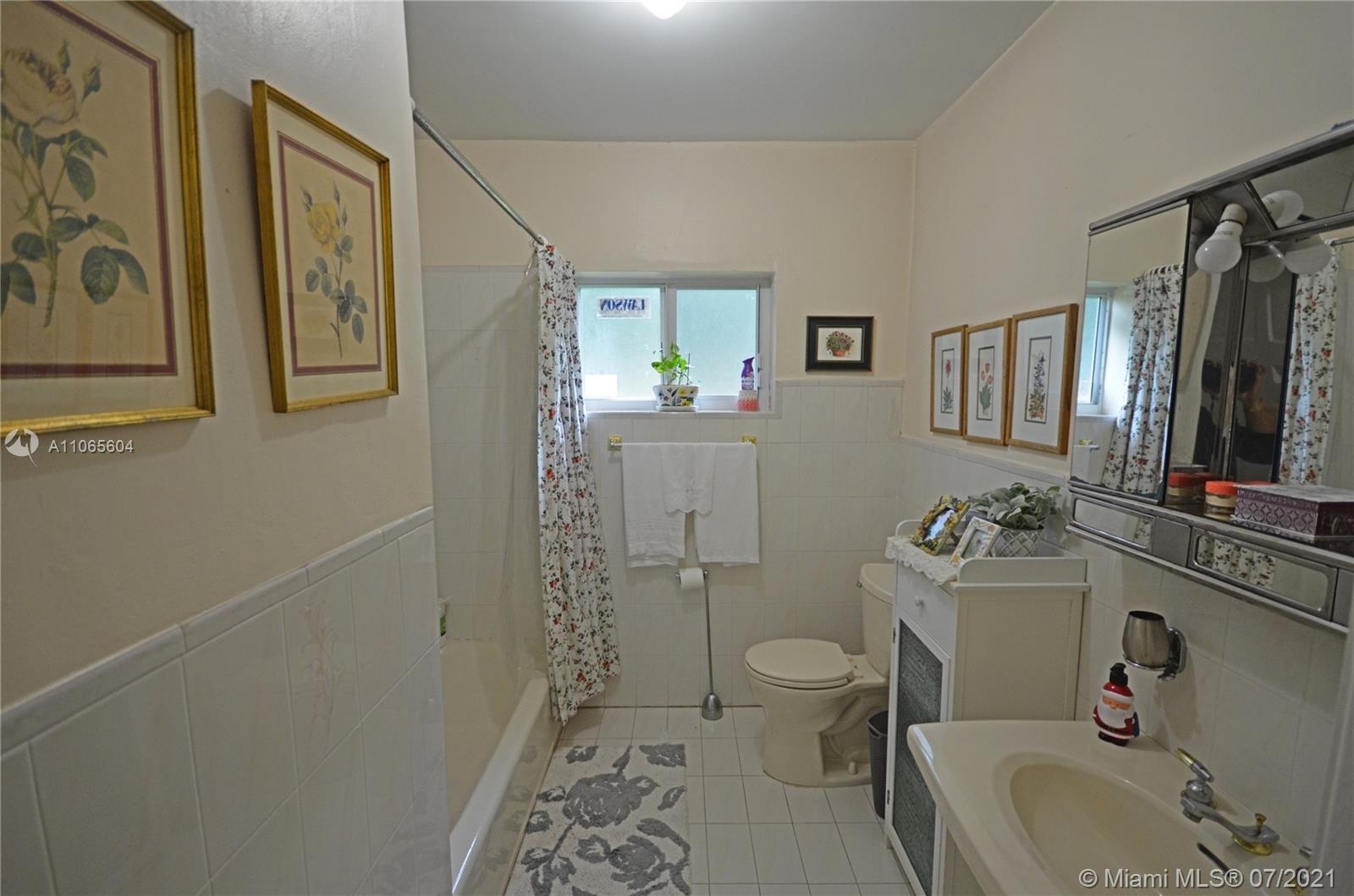 175 Southwest 24th Road Miami, FL 33129 - Photo 11 of 17 a bathroom with a sink toilet and shower