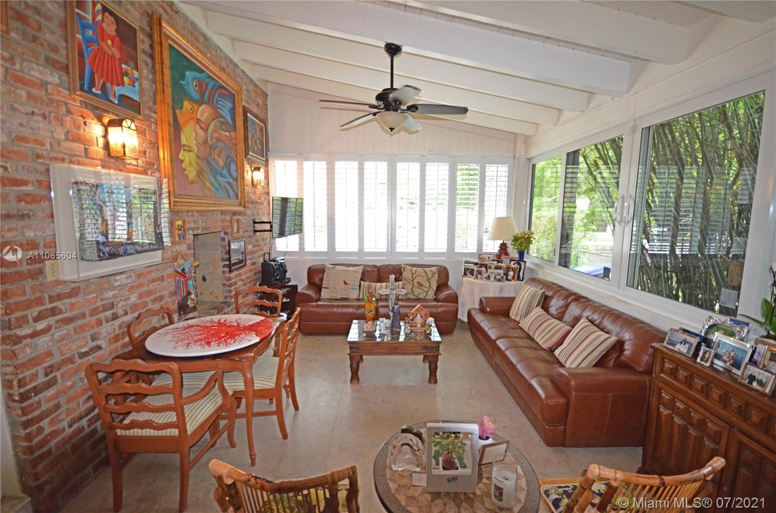 175 Southwest 24th Road Miami, FL 33129 - Photo 13 of 17 a living room with furniture and a large window