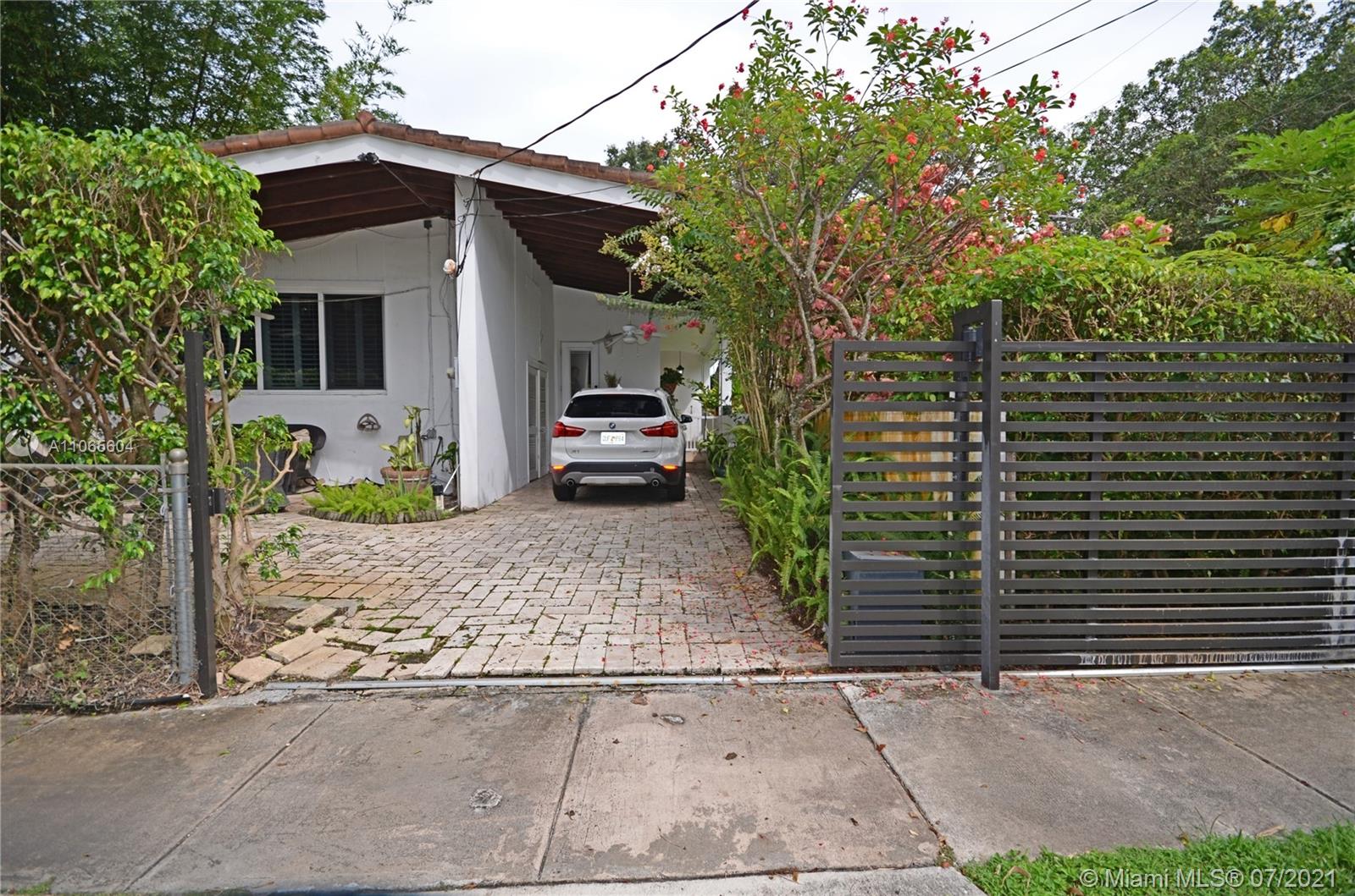 175 Southwest 24th Road Miami, FL 33129 - Photo 17 of 17 a front view of a house with garden