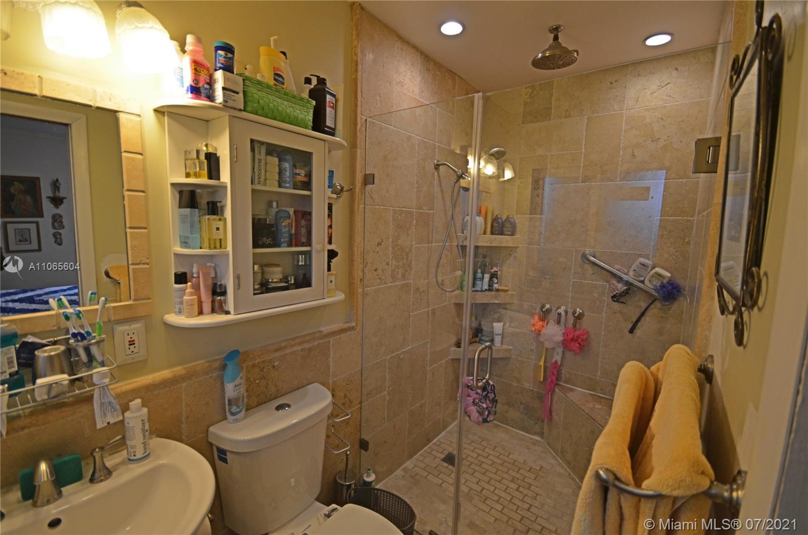 175 Southwest 24th Road Miami, FL 33129 - Photo 6 of 17 a bathroom with a toilet and shower